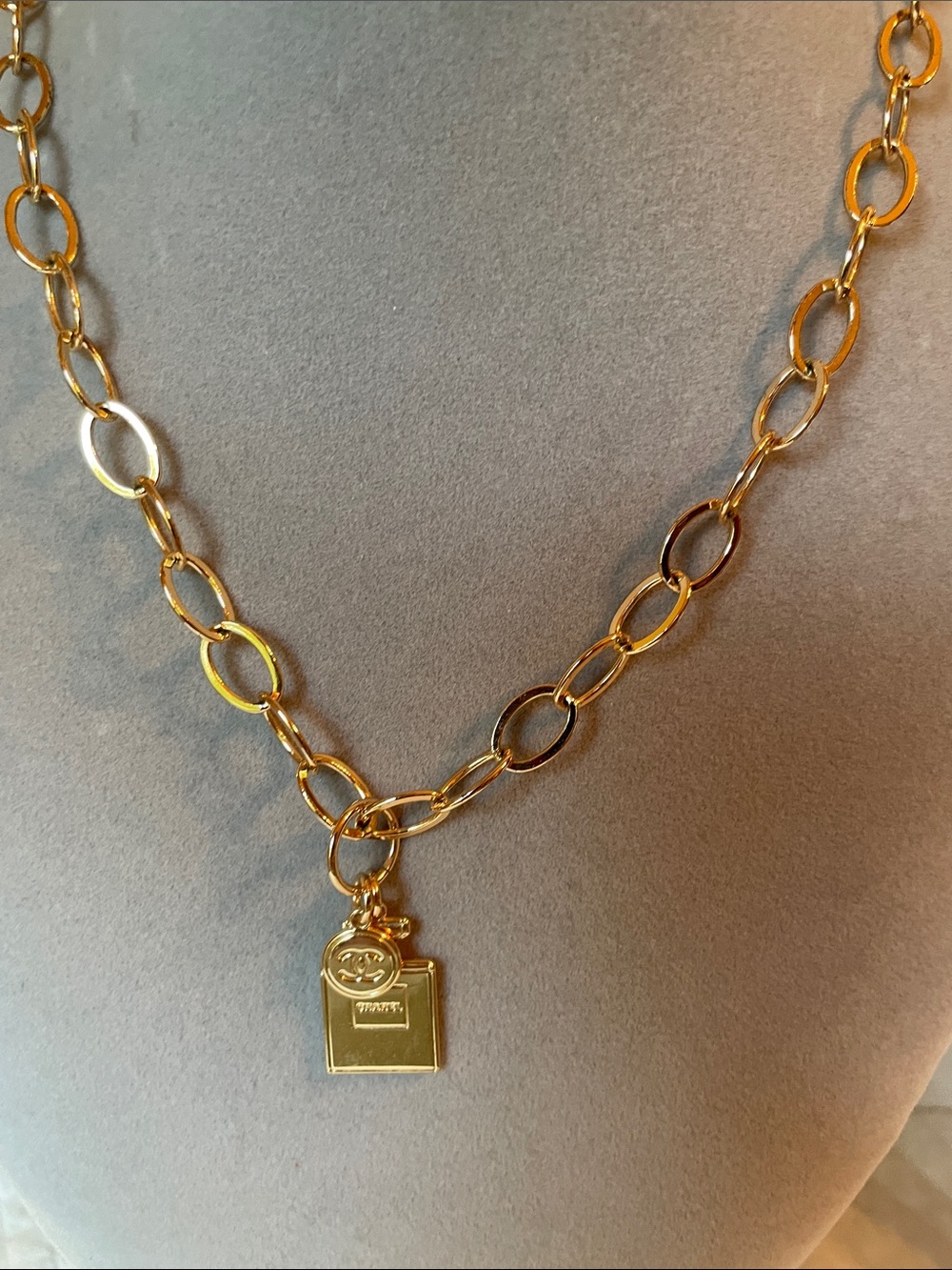 CHANEL Gold-Tone Perfume Bottle Charm with logo